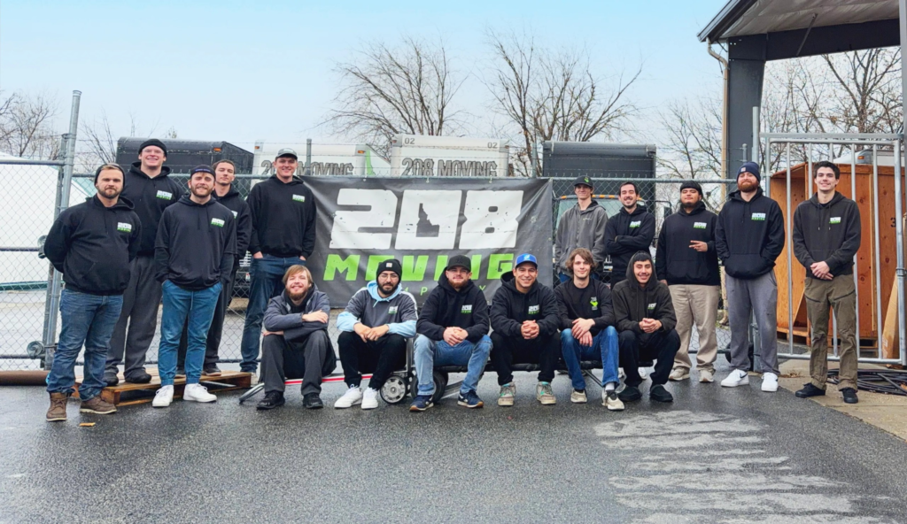 Team photo of 208 Moving professional movers in Boise, Idaho standing in front of company trucks