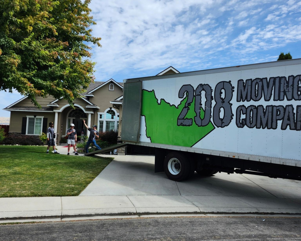 208 Moving truck parked outside a residential home during a local move in Boise, Idaho