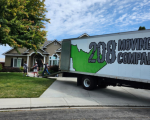 208 Moving truck parked outside a residential home during a local move in Boise, Idaho