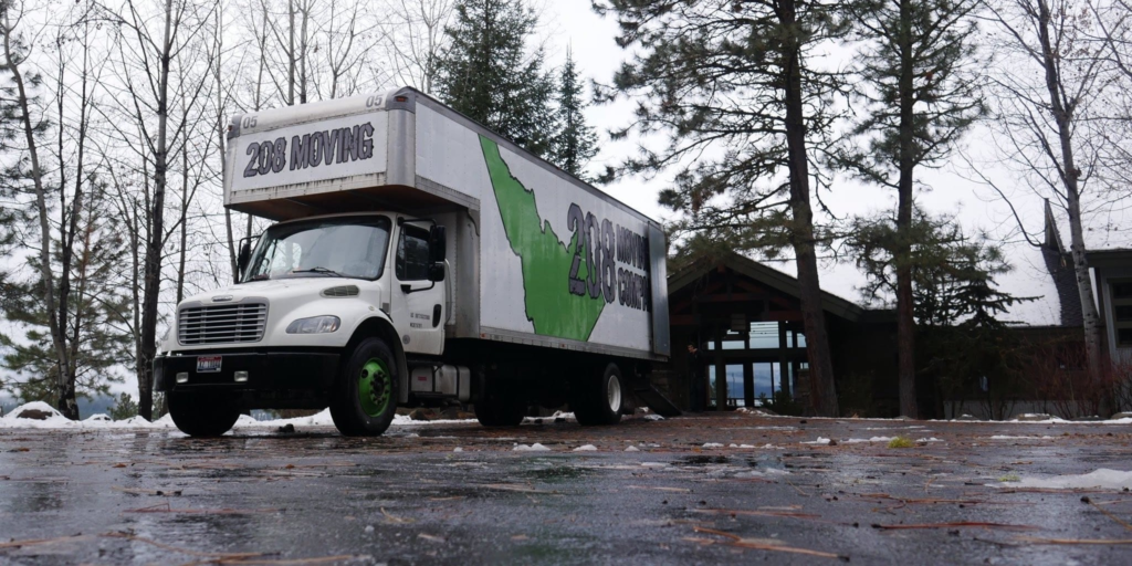 208 Moving Company truck parked at a residential home during a local moving service