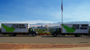 208 Moving Company trucks overlooking downtown Boise skyline and foothills